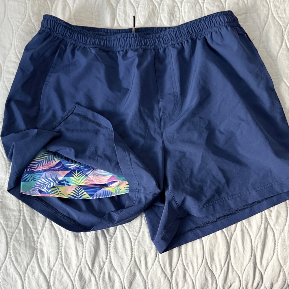 Stylish Blue Men's Swim Trunks with Tropical Accent